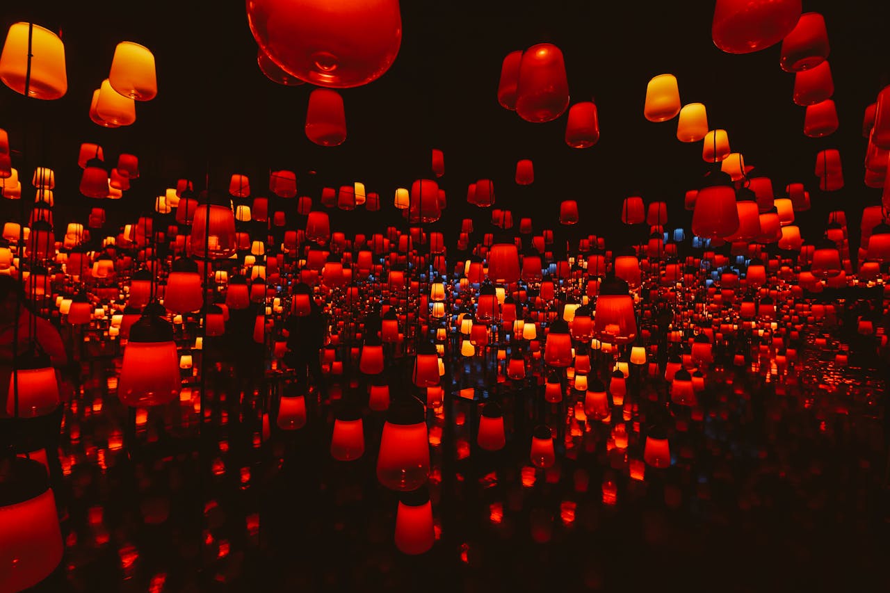 Mesmerizing indoor display of colorful illuminated lanterns creating a surreal atmosphere.
